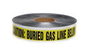 A roll of yellow detectable gas marking tape with text 'CAUTION: GAS LINE BELOW' printed on it, indicating the presence of buried gas lines.