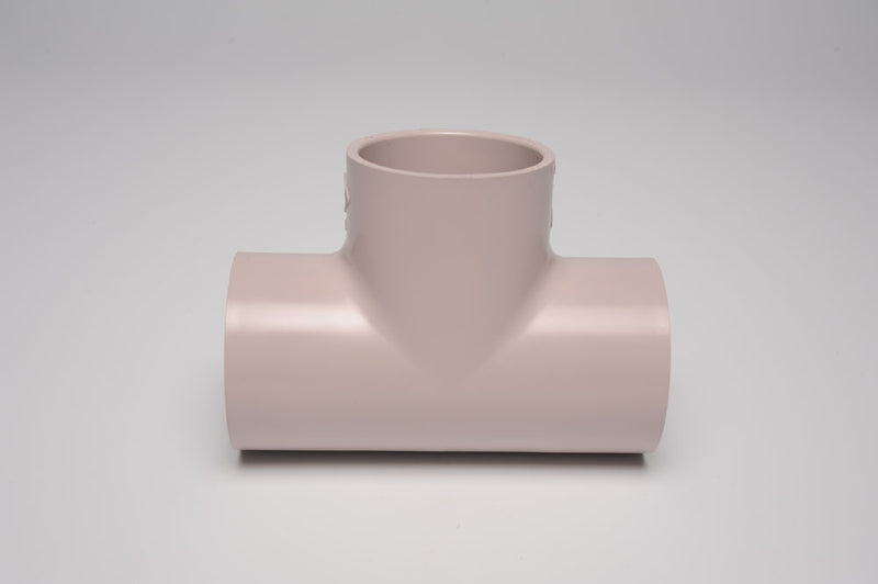 Beige PVC tee fitting with socket connections on three sides