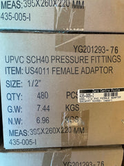 A close-up of a cardboard shipping box printed with product details for UPVC SCH40 pressure fittings, item US4011 female adaptor, size 1/2 inches. Visible text includes measurements, quantity 480 pieces, gross weight 7.