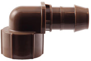 A brown elbow adapter fitting with a female threaded end and a barbed male end for irrigation systems.