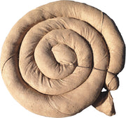 Coiled beige fabric on a white background