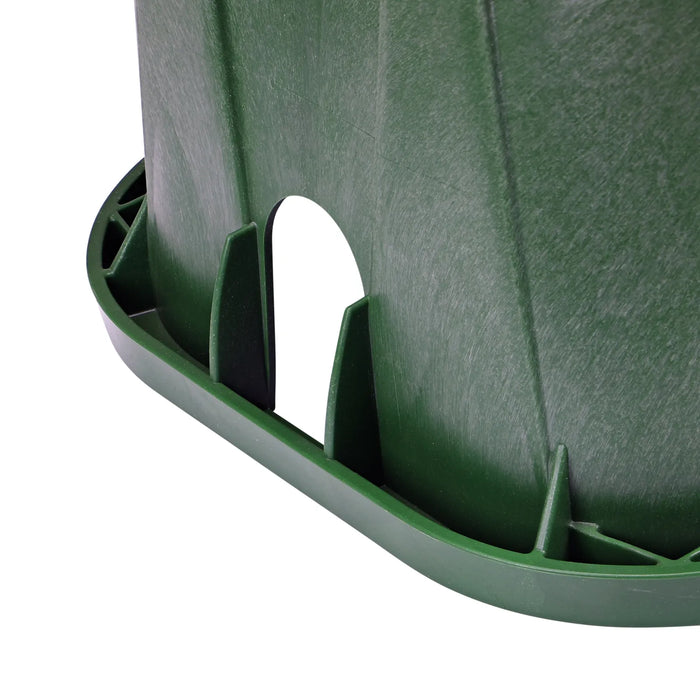 Close-up of a green plastic container with a white object inside on a white background