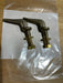 Two brass bolts in a clear plastic bag on a wooden surface
