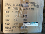 A cardboard shipping box printed with product details for UPVC SCH40 pressure fittings, item US4T01 straight tee, size 1-1/4 inches, quantity 50 pieces, with a barcode label on the front.