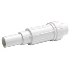 A white PVC repair coupling with slide-action for pipe connections.