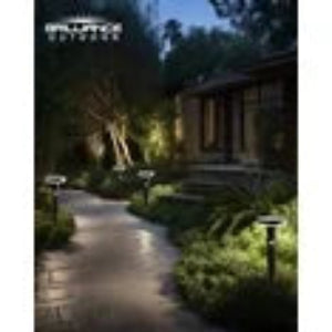 Outdoor garden with stone pathway, plants, and a building in the background