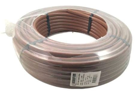 A coil of brown Dura Flo drip tubing wrapped in plastic, with a label indicating the product specifications.