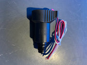 Black electrical connector with wires on a metallic surface