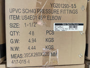 A close-up of a brown cardboard shipping box printed with product details for UPVC SCH40 pressure fittings, item US4E01 45° ELBOW, including size, quantity, weight, and measurements.