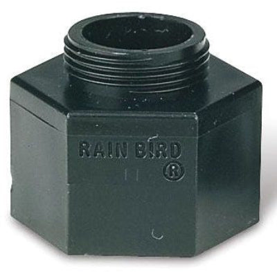 A black plastic Rain Bird shrub adapter with threaded connections for irrigation systems.