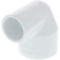 A white PVC 90 degree elbow fitting with socket x socket end connection.