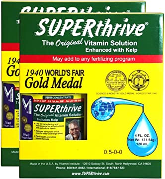 Bottle of SUPERthrive plant vitamin solution with green and yellow label, featuring the product name and branding.