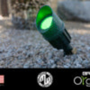 Green bottle with a label on a dark background