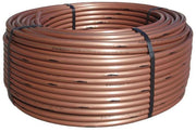 A coil of brown polyethylene drip irrigation tubing.