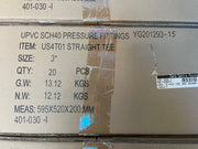 A close-up of a brown cardboard shipping box printed with product details for UPVC SCH40 pressure fittings, including item number US4T01 STRAIGHT TEE, size 3 inch, quantity 20 pieces, and weight information.