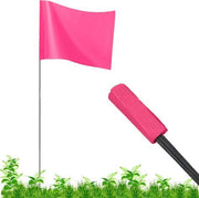 A fluorescent pink wire staff marking flag with a suede/matte finish, displayed in a grassy area, with a visible flag pole.
