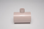 A beige 2 inch by 2 inch by 1 half inch tee-shaped PVC fitting for irrigation supplies.
