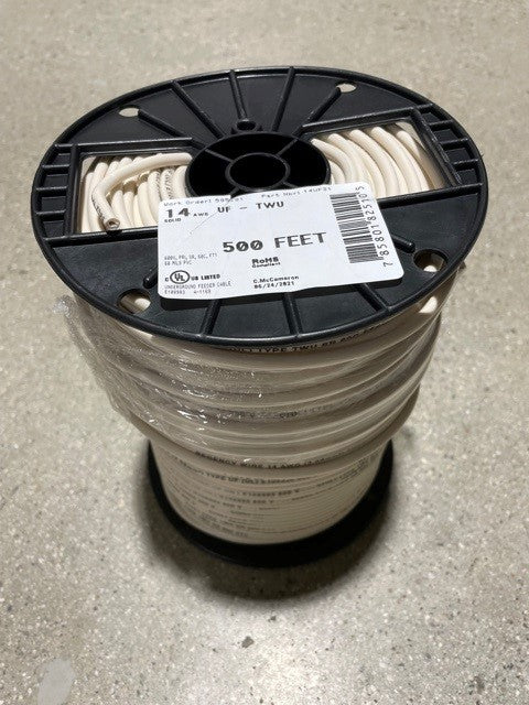 A spool of white irrigation wire labeled as 14 AWG 600 FEET, with a black plastic label on the spool indicating the product specifications.