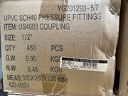 A close-up of a brown kraft paper shipping box printed with product details for UPVC SCH40 pressure fittings, item US4003 coupling, size 1/2 inches. The box shows quantity 480 PCS, gross weight 6.
