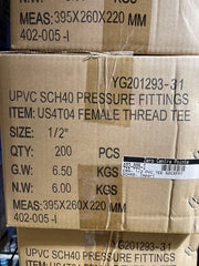 A close-up of stacked cardboard shipping boxes for UPVC SCH40 pressure fittings, with printed text including 'FEMALE THREAD TEE', size 1/2", quantity 200 PCS, and a visible 'Zero Centre Pointe' label.