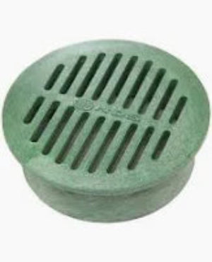 Green plastic drain cover with slotted design on a white background