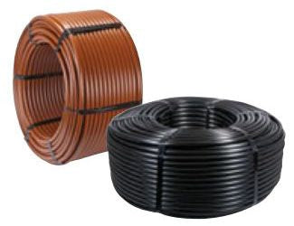 Two coils of distribution tubing, one brown and one black, for irrigation systems.
