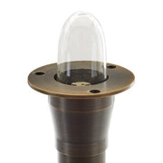 A brass bronze tiki light stem with a clear globe on top, designed for landscape pathway lighting.