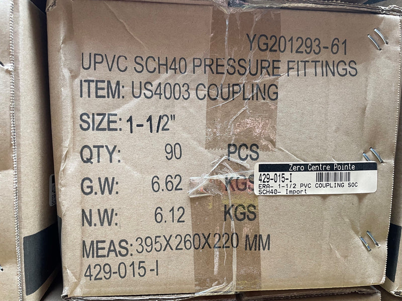 A brown cardboard shipping box printed with black text for 'UPVC SCH40 PRESSURE FITTINGS ITEM: US4003 COUPLING', including size, quantity, gross weight, net weight, and dimensions. A barcode label is visible on the front.
