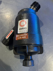 Blue water filter with AMIAD branding on a metallic surface