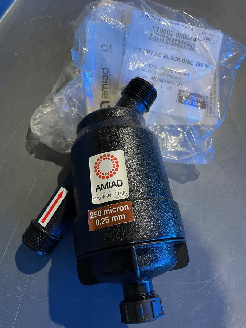 Black filter with AMIAD branding on a metallic surface