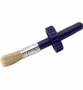 A 1 inch brush with a purple plastic handle and beige bristles, designed for use with can caps.