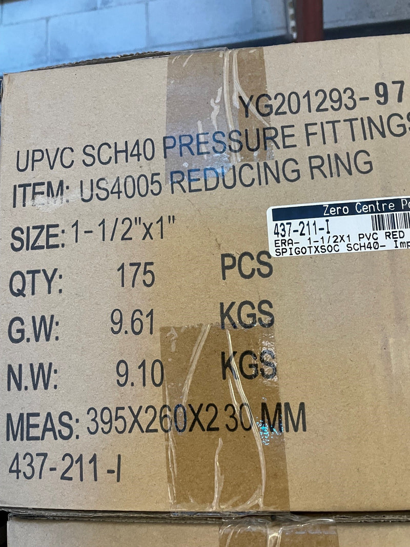 A close-up of a brown cardboard shipping box printed with product details for UPVC SCH40 pressure fittings, item US4005 reducing ring, size 1-1/2" x1", quantity 175 PCS, with a black and white barcode label on the right side.