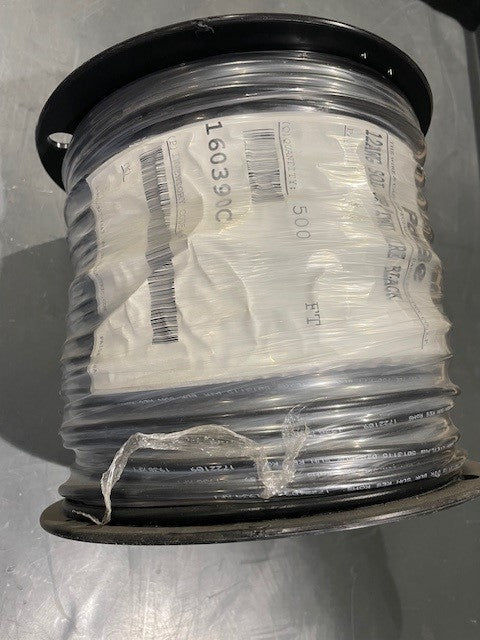 Spool of wire with a label on a gray background