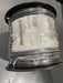 Spool of wire with a label on a gray background