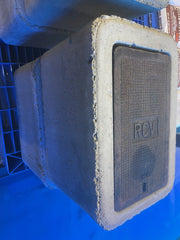 Concrete block with a textured surface and 'RCV' branding on a blue background