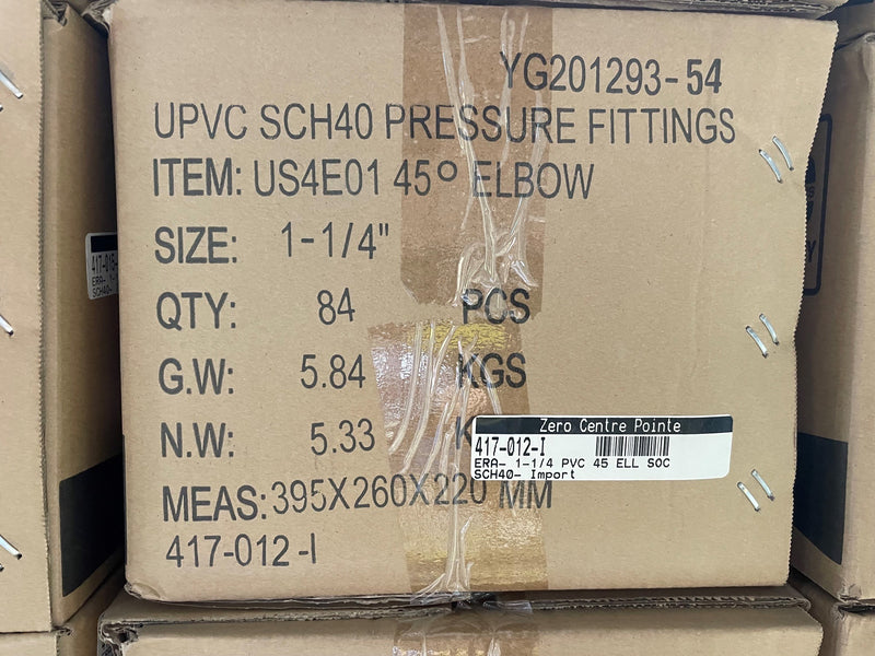A cardboard shipping box for UPCVC SCH40 pressure fittings, specifically a 45-degree elbow. The box contains 84 pieces and has printed specifications including size, quantity, gross weight, net weight, and dimensions.