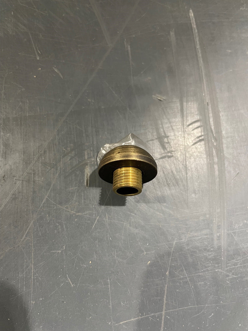 Brass valve stem on a metallic surface