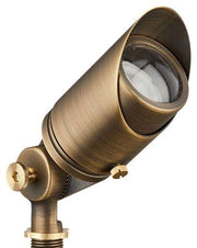 A bronze finish brass spotlight with a clear convex glass lens, designed for landscape lighting.