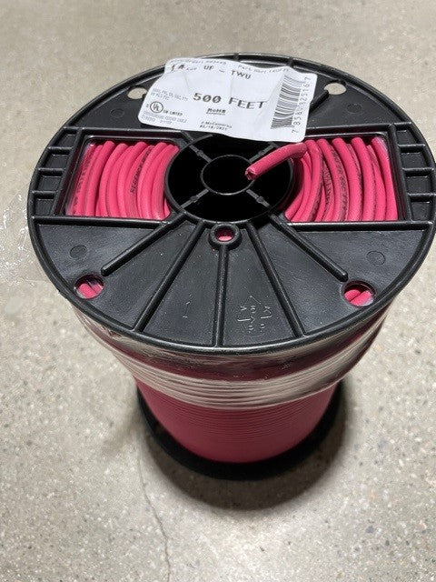 A spool of red-colored underground irrigation wire, with a label indicating '500 FEET' and the brand 'RW'.