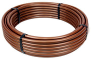 A coil of brown Rain Bird XERI-Flex Blank Tubing designed for irrigation systems.