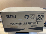 A large cardboard box for PVC pressure fittings, labeled 'PVC PRESSURE FITTINGS SCH4