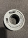 Roll of Aqualine PTFE pipe thread tape on a textured surface