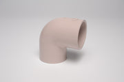 A beige-colored 2-1/2 inch PVC UVR 90 ell socket fitting, SCH40, for plumbing.