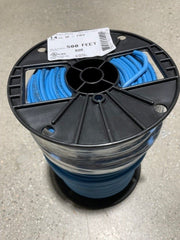 A spool of blue-colored underground irrigation wire inside a black plastic spool with a label indicating the product details.