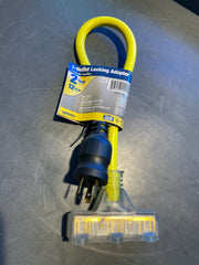 A 2-foot yellow U-shaped outlet locking adapter cable with a black plug, shown in its retail packaging on a scratched gray metal surface.