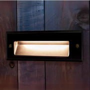Rectangular light fixture on a wooden surface