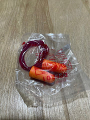 Orange earplugs in a clear plastic bag on a wooden surface