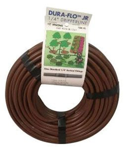 A coil of brown Dura Flo Jr dripline tubing with packaging visible.
