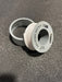 Spool of PTFE pipe thread tape on a textured gray background