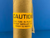 Roll of paper with a yellow caution label on a blue background